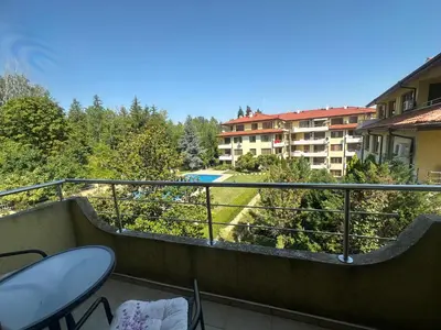 a balcony with a view of a building at Sunny Seasons top view apartment SEA&POOL in Byala