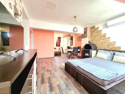 a bedroom with a bed and a living room at Sea Star Studio-to the Sea Garden in Burgas City
