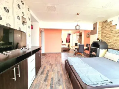 a room with a bed and a living room at Sea Star Studio-to the Sea Garden in Burgas City