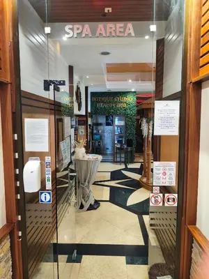 a spa area with a sign on the door of a store at Emerald Apartman Wellness & Spa in Ravda