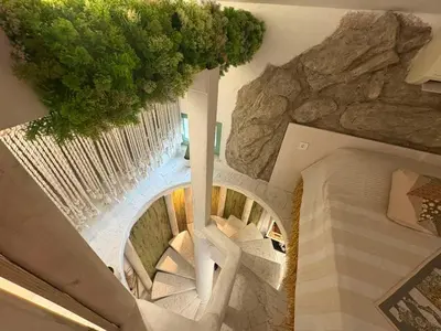an overhead view of a spiral staircase in a building at Flores Gardan ART Studio in Chernomorets