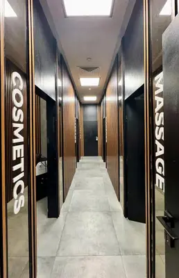 a hallway of a dressing room with wooden walls at Flores Gardan ART Studio in Chernomorets