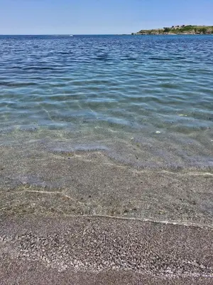 a large body of water with a rocky shore at Relax in Tsarevo