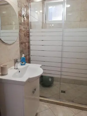 a bathroom with a sink and a shower at Relax in Tsarevo
