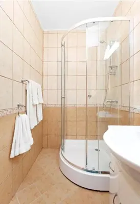 a bathroom with a shower and a sink at The white flat in Byala