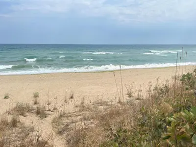 a sandy beach with the ocean in the background at Палатка на Кара Дере in Byala
