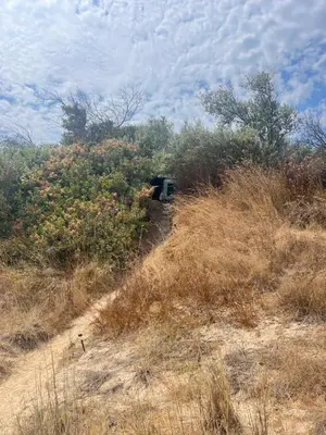 a bench sitting on the side of a hill at Палатка на Кара Дере in Byala