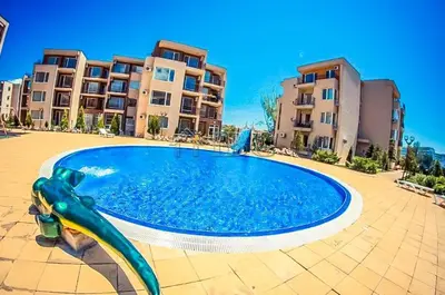 a slide in a swimming pool in front of some apartments at Nesebar - Orchid 278 in Sunny Beach