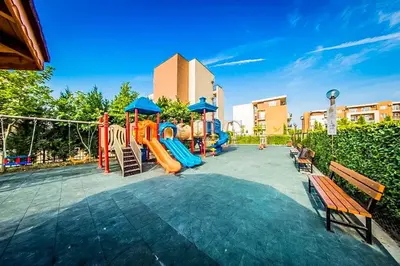 a playground with a slide and a play equipment at Nesebar - Orchid 278 in Sunny Beach