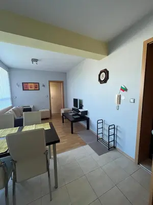 a living room with a couch and a table at 2-bedroom Apartment in Marina Holiday Club Pomorie in Pomorie