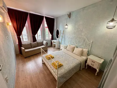 a bedroom with a bed and a couch at ap Knyaz Boris I in Varna City