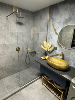 a bathroom with a sink and a shower at ap Knyaz Boris I in Varna City