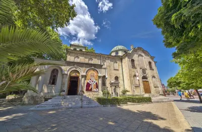 an old church with a palm tree in front of it at ap Knyaz Boris I in Varna City