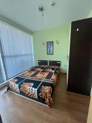 a bedroom with a bed with tigers on it at Private 2-Bedroom Apartment with Pool and Free Parking in Marina Holiday Club Pomorie in Pomorie