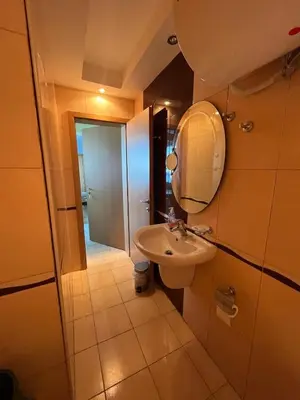 a bathroom with a sink and a mirror at Private 2-Bedroom Apartment with Pool and Free Parking in Marina Holiday Club Pomorie in Pomorie