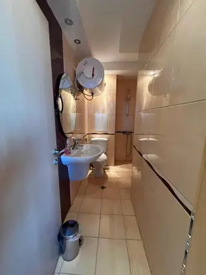 a bathroom with a sink and a toilet at Private 2-Bedroom Apartment with Pool and Free Parking in Marina Holiday Club Pomorie in Pomorie