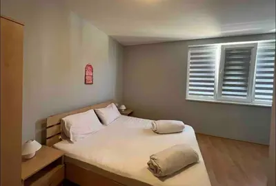 a small bedroom with a bed and a window at Two bedroom Apartment in Fort Noks Panorama beach in Elenite