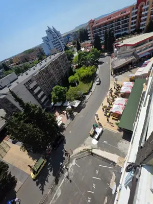 an overhead view of a city street with a parking lot at Apartment Miramar Palace in Sunny Beach