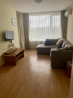 a living room with a couch and a table at Peaceful, Top Floor, 2 Bedroom in Sunny Beach