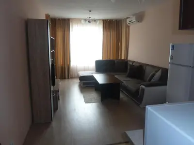 a living room with a couch and a table at Anfid Apartments in Burgas City