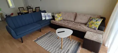 a living room with a couch and a table at Imperial Sea View in Burgas City