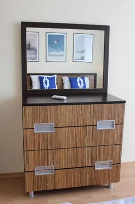a dresser with a mirror on top of it at Imperial Sea View in Burgas City