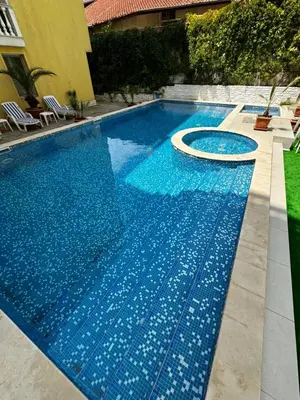 a large blue swimming pool with a white object in it at Sea View Apartment Sveti Vlas in Sveti Vlas
