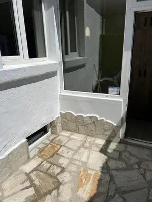 an open door of a building with a stone floor at KOKO House in Varna City