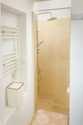 a bathroom with a shower and a toilet at KOKO House in Varna City