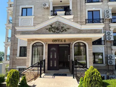 a front door of a building with at Onyx Sveti Vlas частни апартаменти in Sveti Vlas