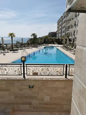 a view of a swimming pool from a balcony at Onyx Sveti Vlas частни апартаменти in Sveti Vlas
