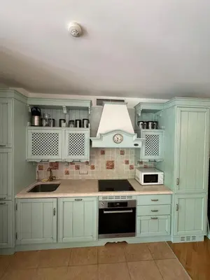 a kitchen with white cabinets and a sink at Апартамент в Лозенец, Oasis Resort and Spa in Lozenets