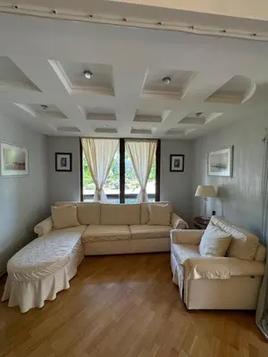 a living room with a couch and two couches at Апартамент в Лозенец, Oasis Resort and Spa in Lozenets