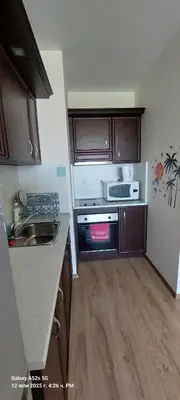 a small kitchen with a sink and a stove at Sunrise Apartment 14 in Obzor