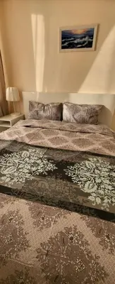 a bedroom with a large bed in a room at Apartament Silvi Super View in Varna City