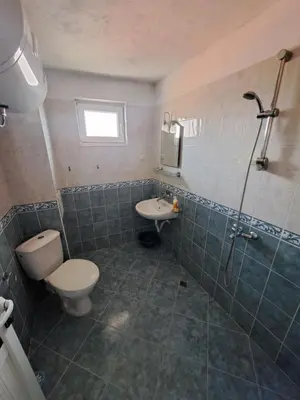 a bathroom with a toilet and a sink at Guest House Polikseni in Sozopol