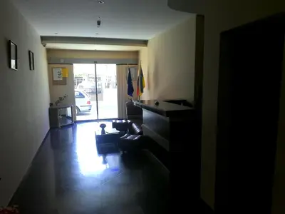 a hallway with a living room with a couch at Alexandrov Residence Studio in Nesebar