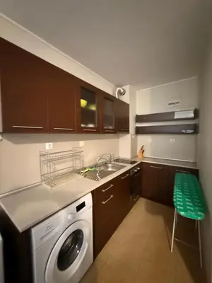 a kitchen with a sink and a washing machine at South Beach Vigo Studio in Nesebar