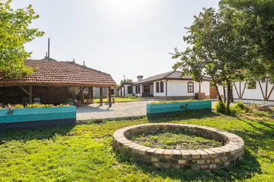 a garden with a brick circle in the grass at Augusta's Authentic Farm House in Pchelnik