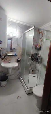 a bathroom with a shower and a toilet and a sink at Свети Влас Етъра1 in Sveti Vlas