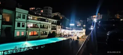 a view of a building at night with a swimming pool at Свети Влас Етъра1 in Sveti Vlas