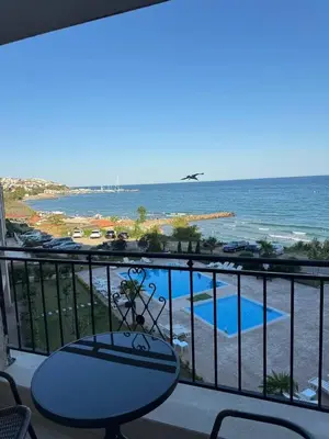a balcony with a view of the ocean at Ипанемма апартамент с 1 спальней in Sveti Vlas