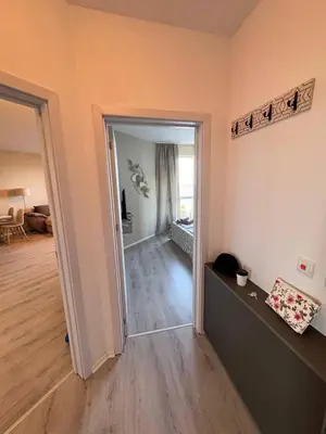 a room with an open door to a living room at Ипанемма апартамент с 1 спальней in Sveti Vlas