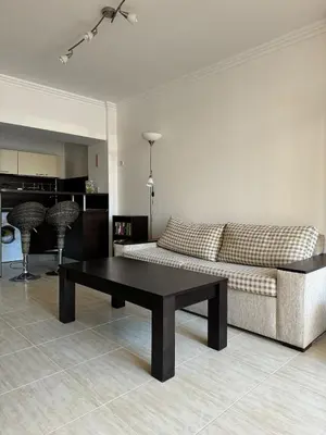 a living room with a couch and a coffee table at Arena Apart in Sveti Vlas