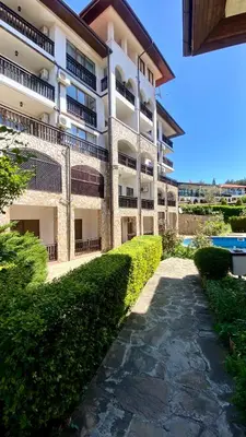 a building with a walkway in front of it at Arena Apart in Sveti Vlas