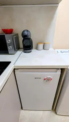 a kitchen with a white counter top with a appliance at Elegant studio - 100 m from Smokinya Beach by Flat Mаnager in Sozopol