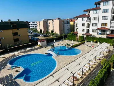 an overhead view of two swimming pools in a city at Апартамент у моря in Nesebar