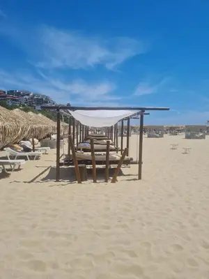 a picnic shelter on the beach on the sand at Etara 4 in Sveti Vlas