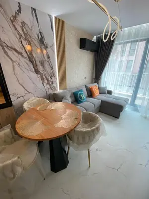 a living room with a table and a couch at Sweet Home 9 in Sunny Beach