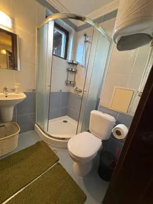 a bathroom with a shower and a toilet and a sink at Kombani 3 in Sveti Vlas